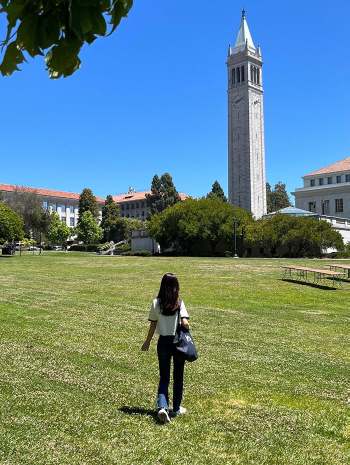 Jeongseo Kim walking toward the Berkeley Campanille