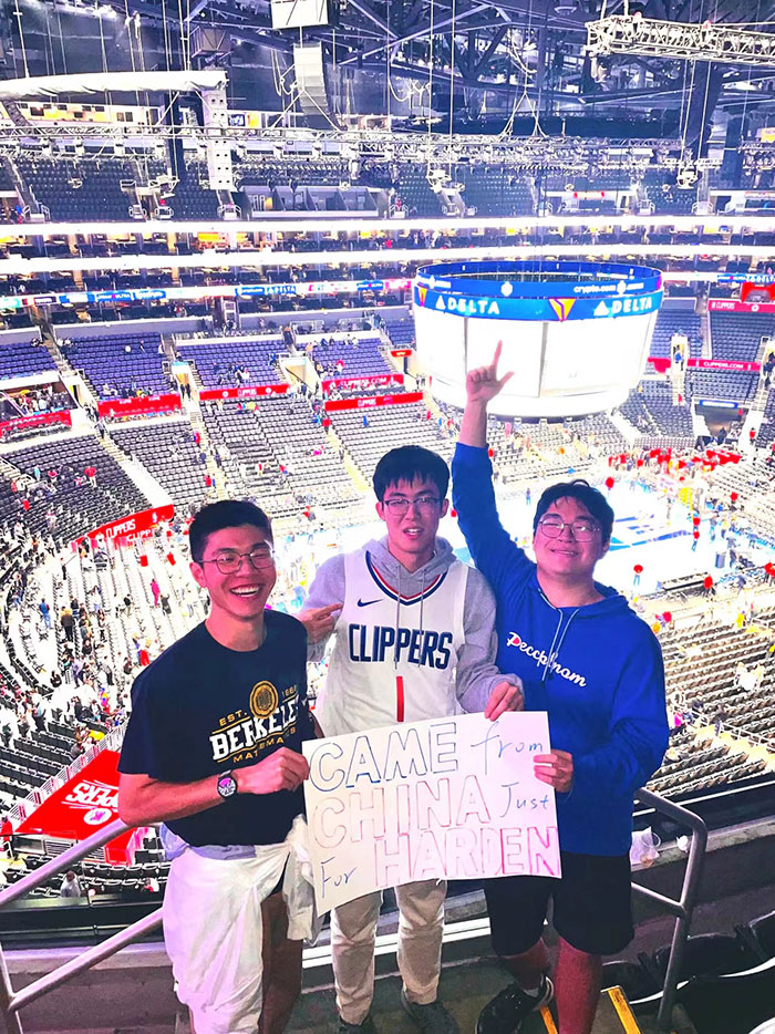 Xiangjian Zhang and friends attending an Oakland Warriors basketball game