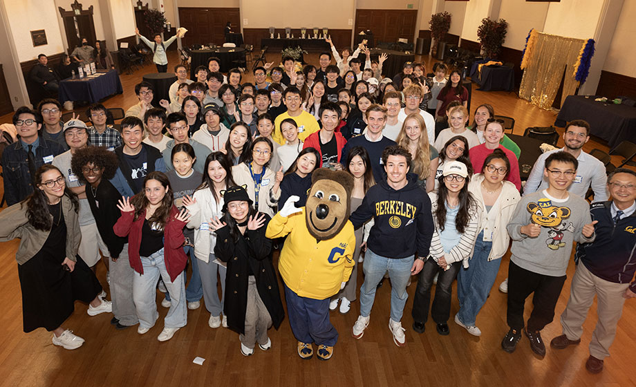 Large group of international students in a photo with UC Berkeley Oski bear mascot