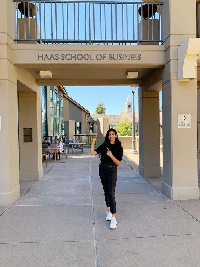 Shreya Nemani poses in front of Berkeley Haas sign 