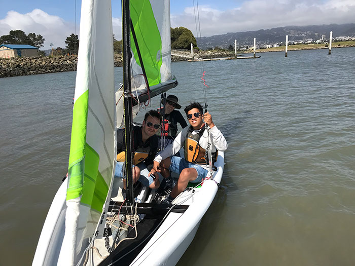 Luis Aguirre and friends on a sail boat in the Bay Area