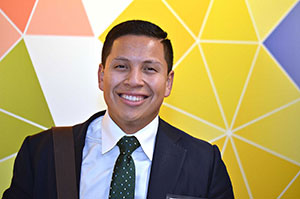 Panelist Jose Campos stands in front of the camera