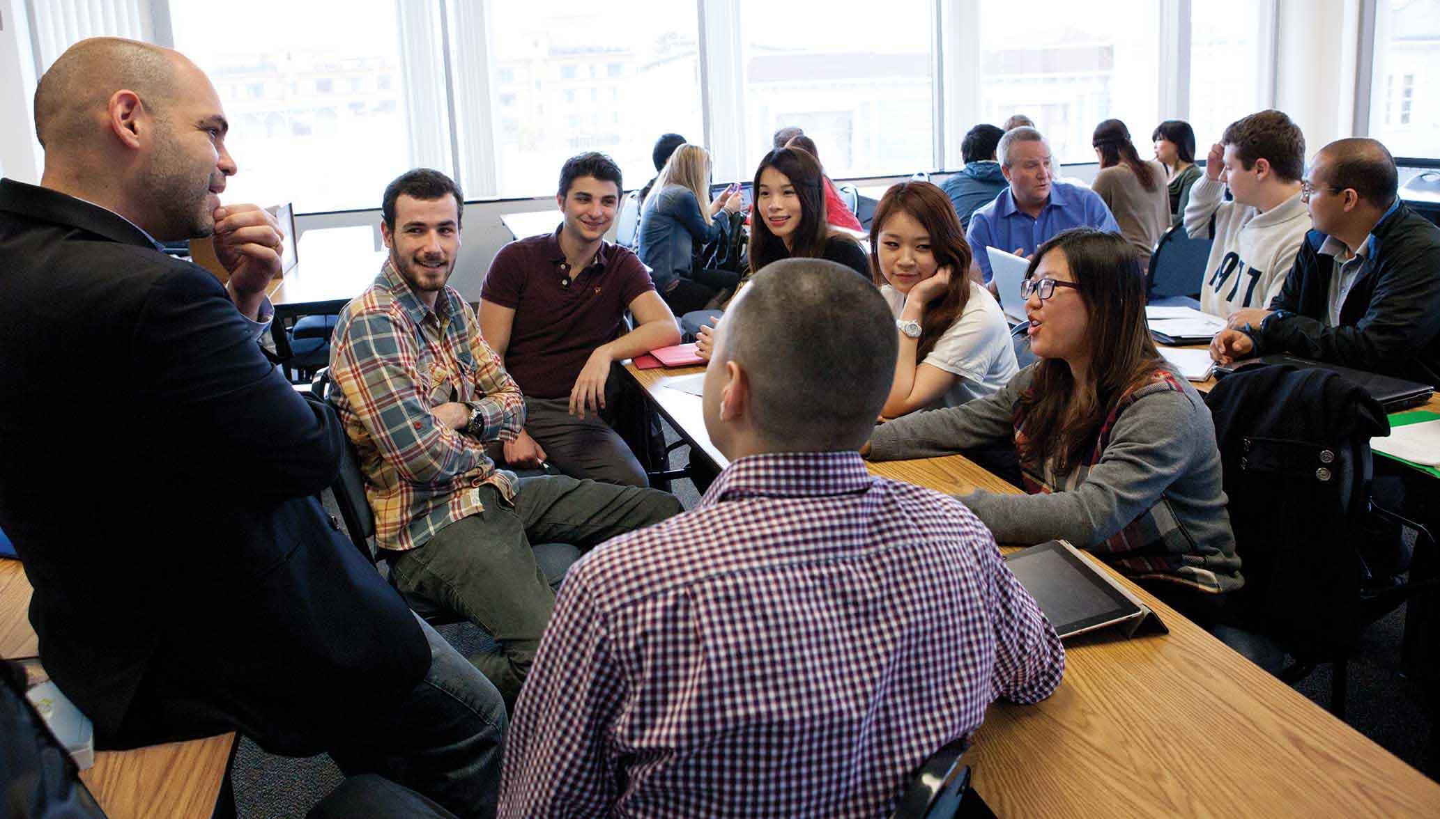  A classroom where the teacher and the students are having a discussion