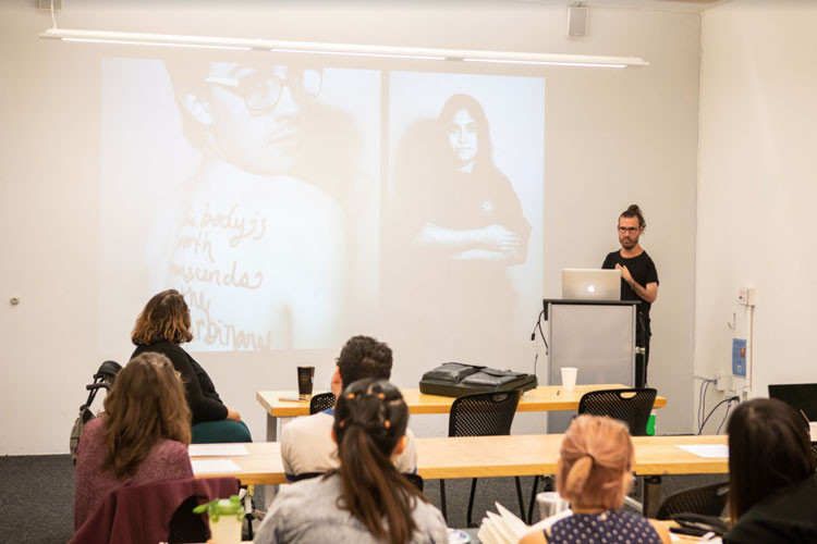 Josh giving a lecture to design students at California College of the Arts. He is joined by co-organizer, Catherine Callahan. The slide features Hannah Soyer’s This Body is Worthy project—an ongoing campaign celebrating bodies that fit outside social idea