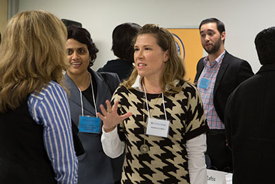 Sabrina Lowell chatting with attendees