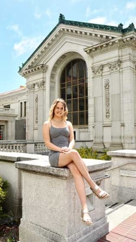 Hannah Boettge sitting in front of UC Berkeley Doe library