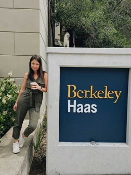 Aliona Margulis in front of the Berkeley Haas sign