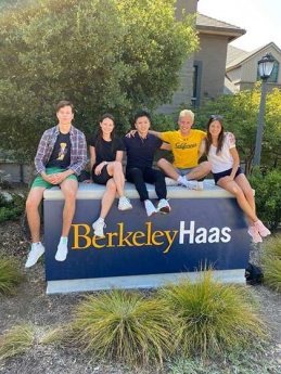 Aliona Margulis and friends in front of the UC Berkeley Haas sign