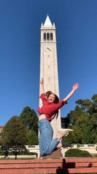 Lilly May jumping in front of the UC Berkeley iconic Campanille