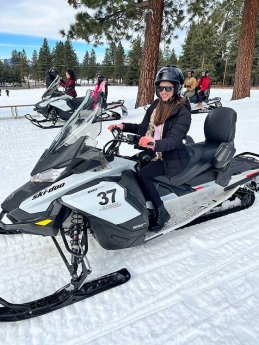 Meru Sharma on a snowmobile