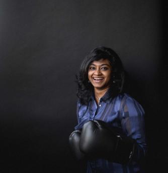 Data Science graduate Swathi Annamalai with boxing gloves on