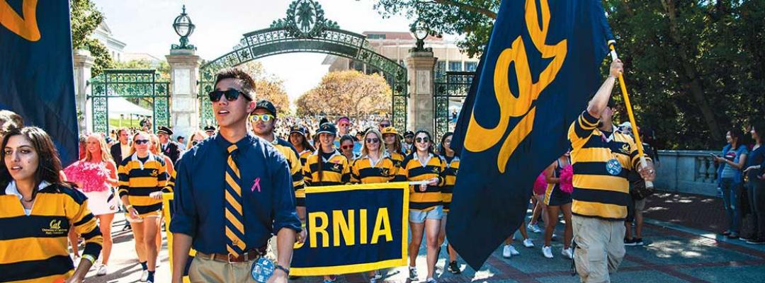 UC Berkeley students holding Cal floag and banner in a parade