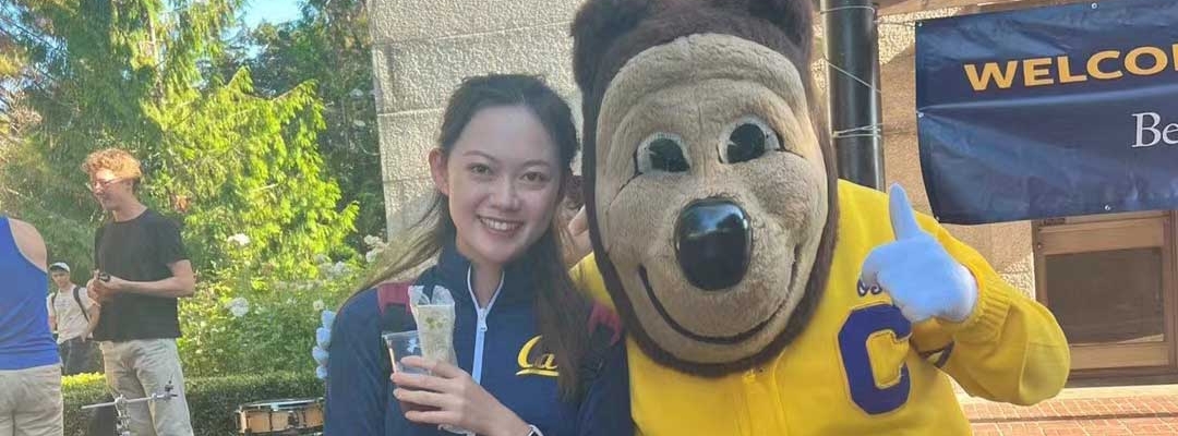 Lucy Zhang and Berkeley Oski mascot take photo together