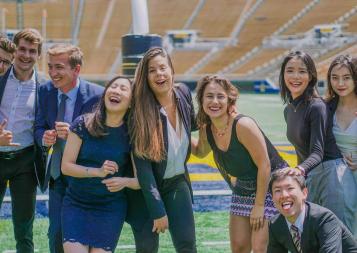  Karin and BHGAP grads pose for a photo on the Cal football field