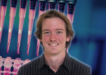 Post-Baccalaureate Health Professions Program alum Alexander Craig with lab stock photo background