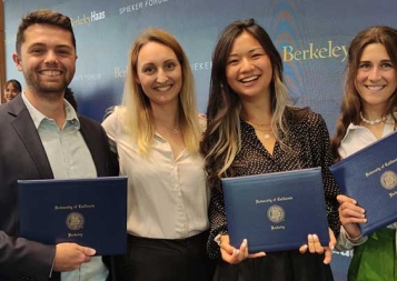 Hugo Charre and friends at the Berkeley Haas Global Access Program graduation holding their diplomas