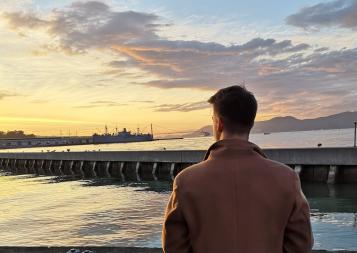 BHGAP student Markus looks out at the San Francisco Bay during sunset 