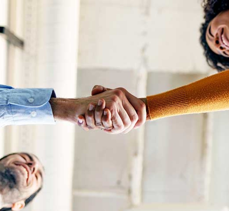 Photo of two people shaking hands