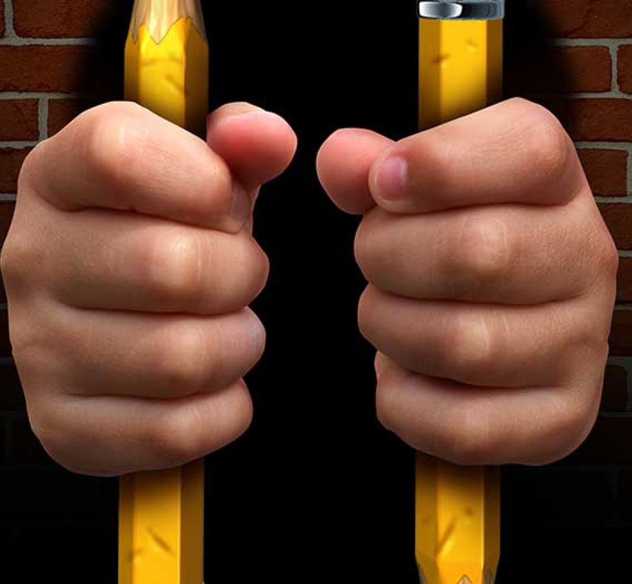 Photo of person in jail with pencils as the jail bars