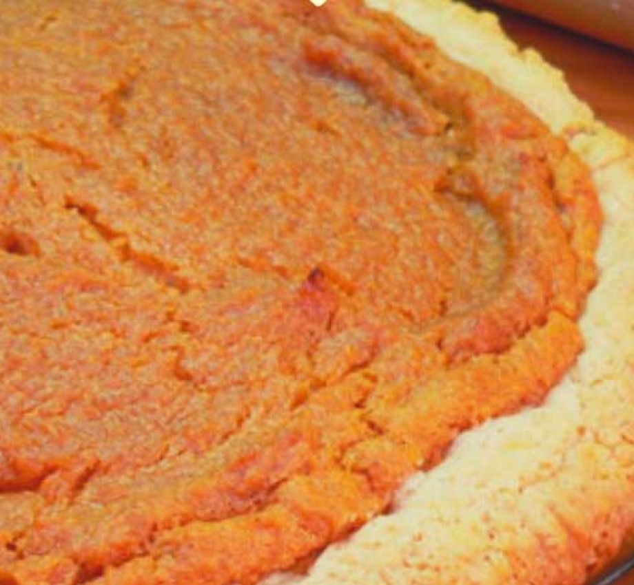 photo of a baked sweet potato pie resting on a cooling rack