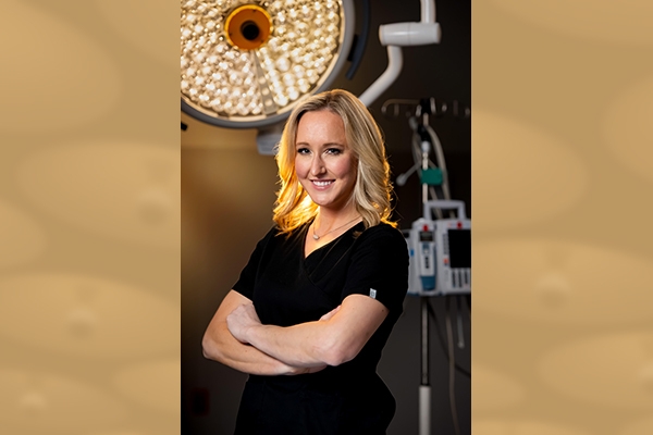 Photo of Meagan Barry in front of medical equipment with illustrative background