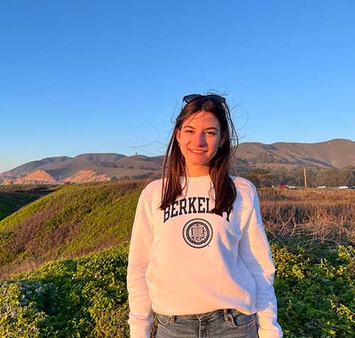 Lea Muller wearing a Berkeley sweatshirt while on a hike