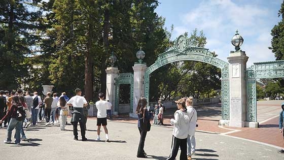 Students mingling in front of Sather Gate on UC Berkeley campus