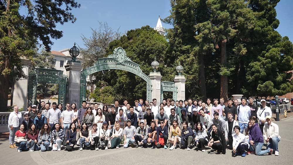 Full group shot of visiting students at Sather Gate