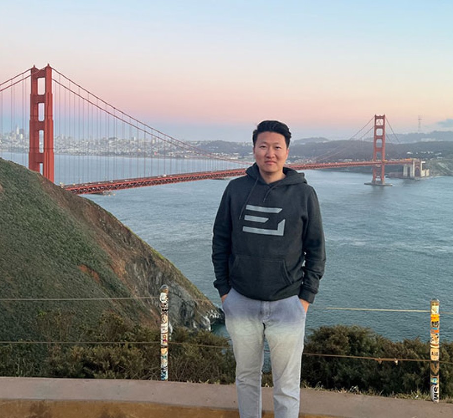 Photo of Michael Zhao in front of Golden Gate Bridge