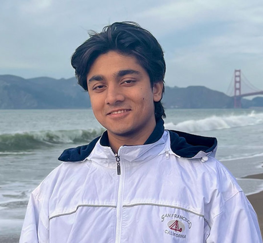 Photo of Tashrique Ahmed in front of Golden Gate Bridge