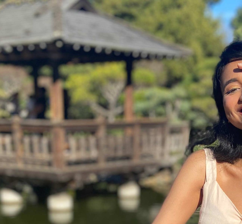 A girl standing in a Japanese tea garden