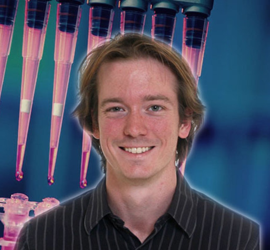 Post-Baccalaureate Health Professions Program alum Alexander Craig with lab stock photo background