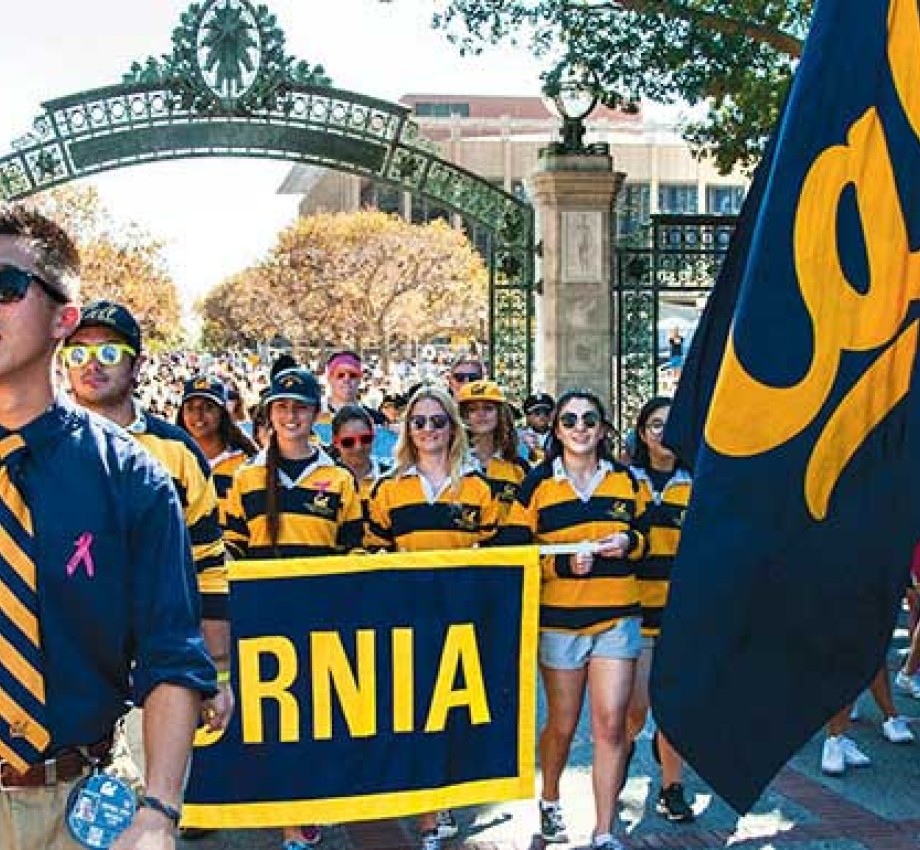 UC Berkeley students holding Cal floag and banner in a parade