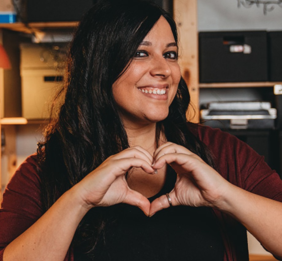 Italian American woman making a heart with her hands