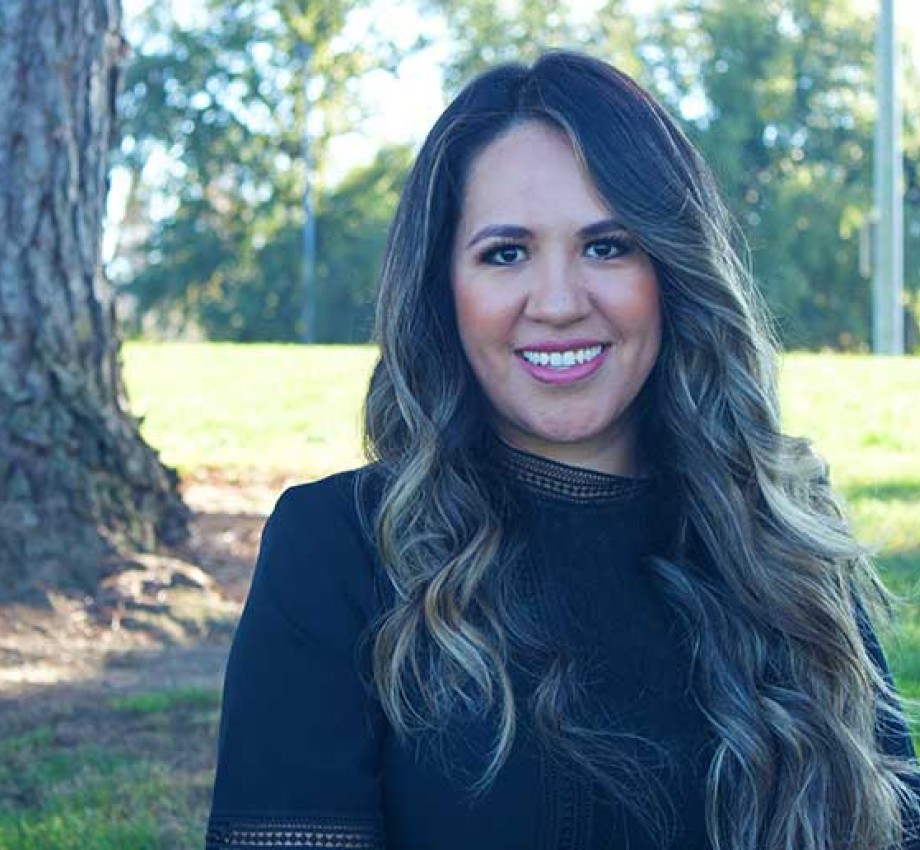 Kenia Macias standing outside in front of a tree