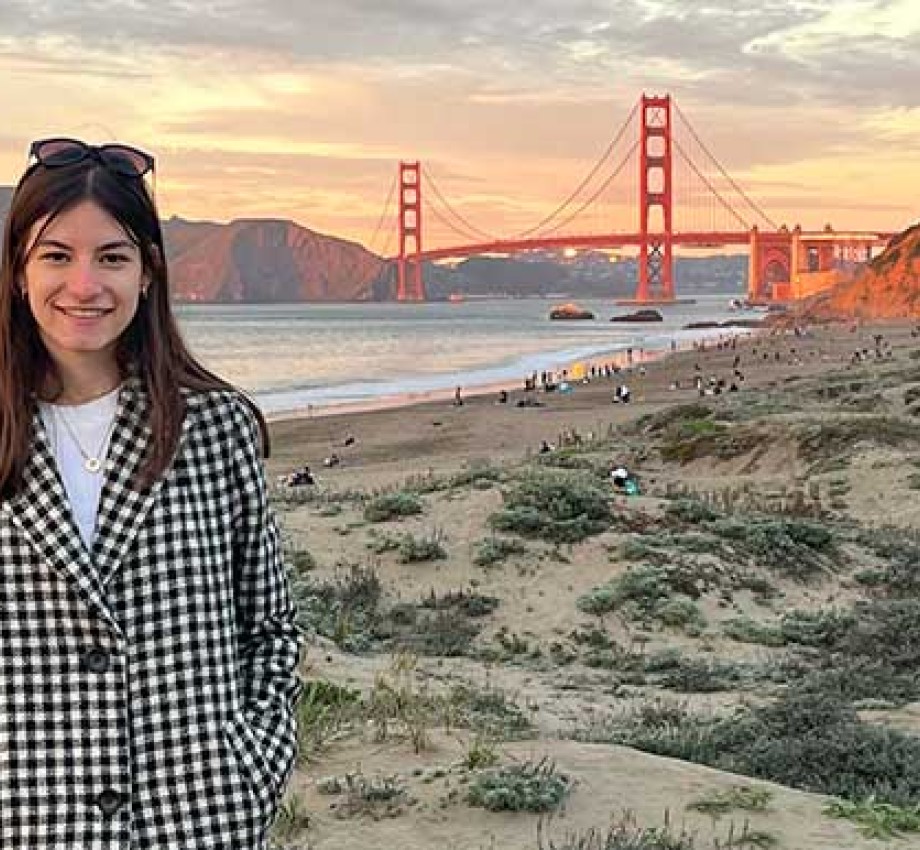 Photo of Lea Muller on a beach with Golden Gate Bridge in the background