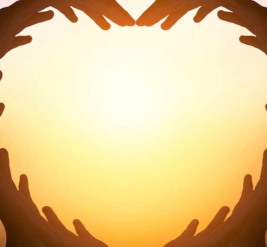 Illustration of hands joined together to shape a heart with sun in background