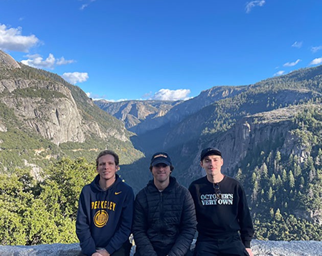 Eduardo Fatio and friends taking a photo in front of picturesque Yosemite National Park