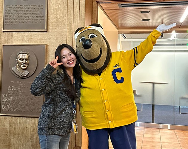 Jeongseo Kim takes a photo with UC Berkeley mascot Oski Bear