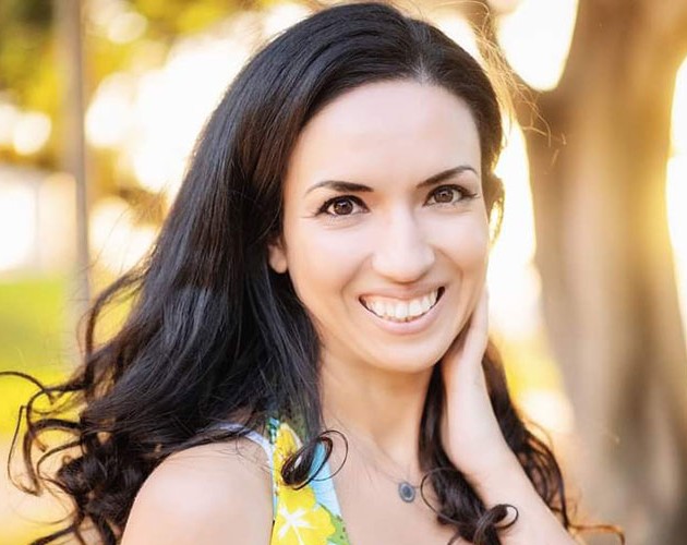 Photo of Sheyla Jafarova in front of a tree at sunset