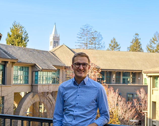 Sebastian Sartor standing in front of Berkeley Haas building