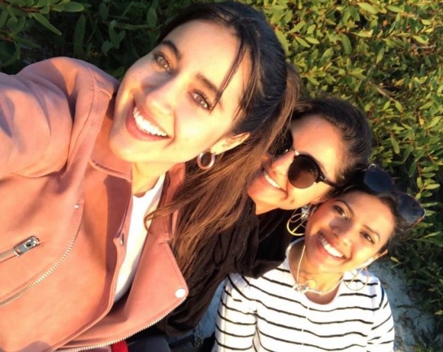 Luisa, pictured far left, poses for a photo with friends from the program.