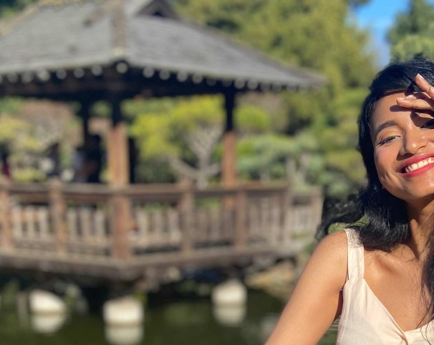 A girl standing in a Japanese tea garden