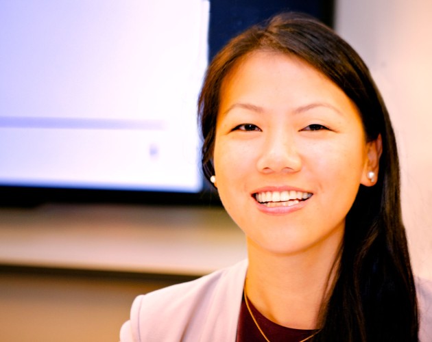 panelist siwei tang in front of a monitor display