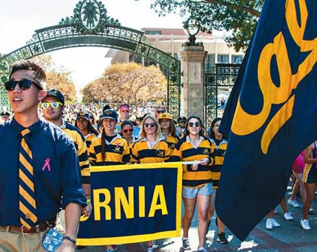 UC Berkeley students holding Cal floag and banner in a parade