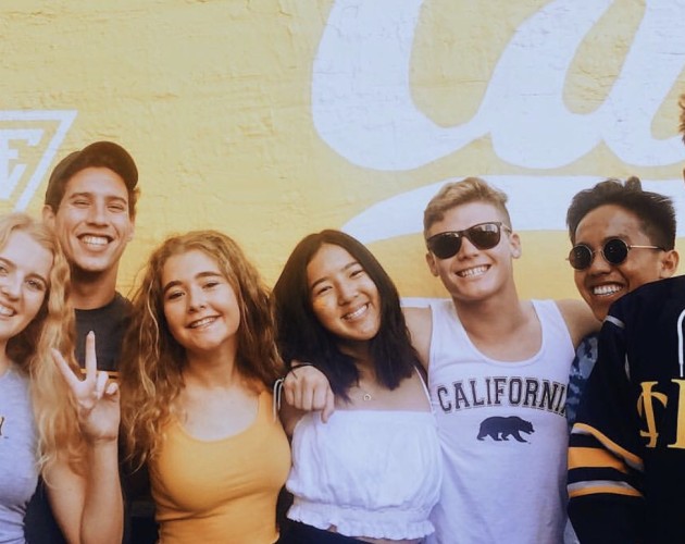 Berkeley undergraduates happily pose in their Cal gear.