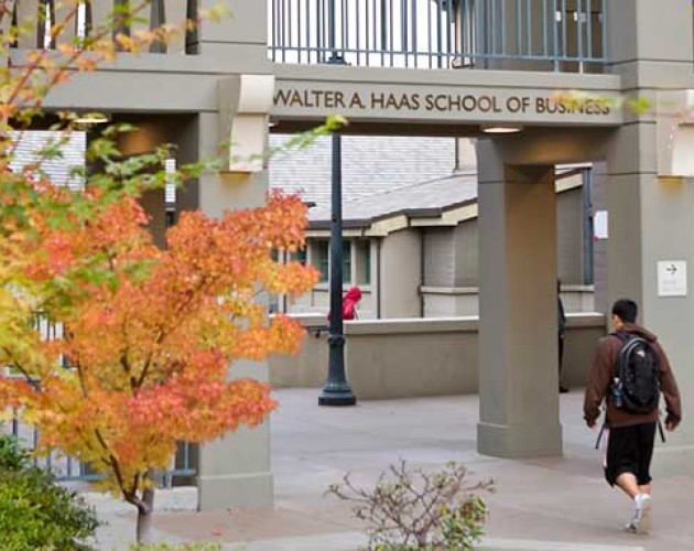 Photo of students walking under Haas School of Business archway