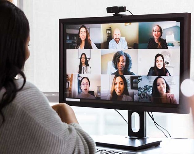 Black woman working from office on a teleconference call