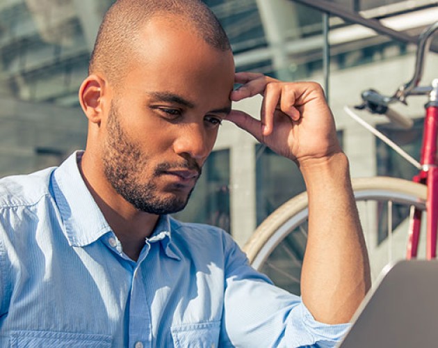 Stock photo of career changer looking at job listings