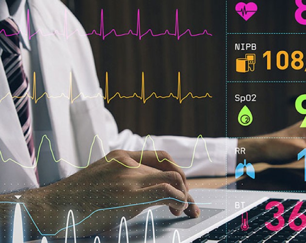 Chest-view stock photo of a male medical professional working on a laptop with medical records overlayed on shot